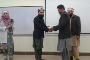 Dr Asif presenting to Dr Zafar