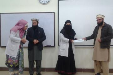 Dr Hamid presenting to Dr Aqsa